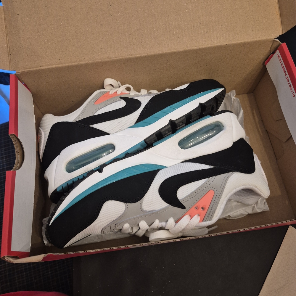 Nike Air Max Shoes in Black, White, and Teal with Orange Accents